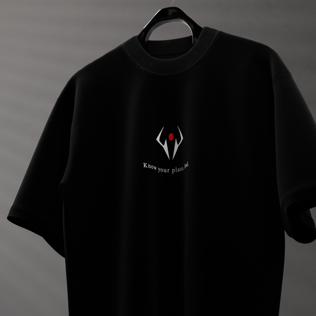Sukuna black oversized t-shirt on hanger featuring small white and red emblem and subtle centered slogan