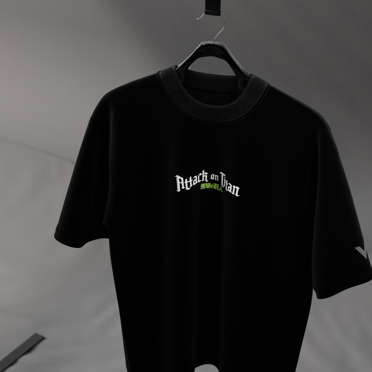 Vlack Eren Yeager black oversized t-shirt hanging on a hanger featuring small Attack on Titan logo center chest