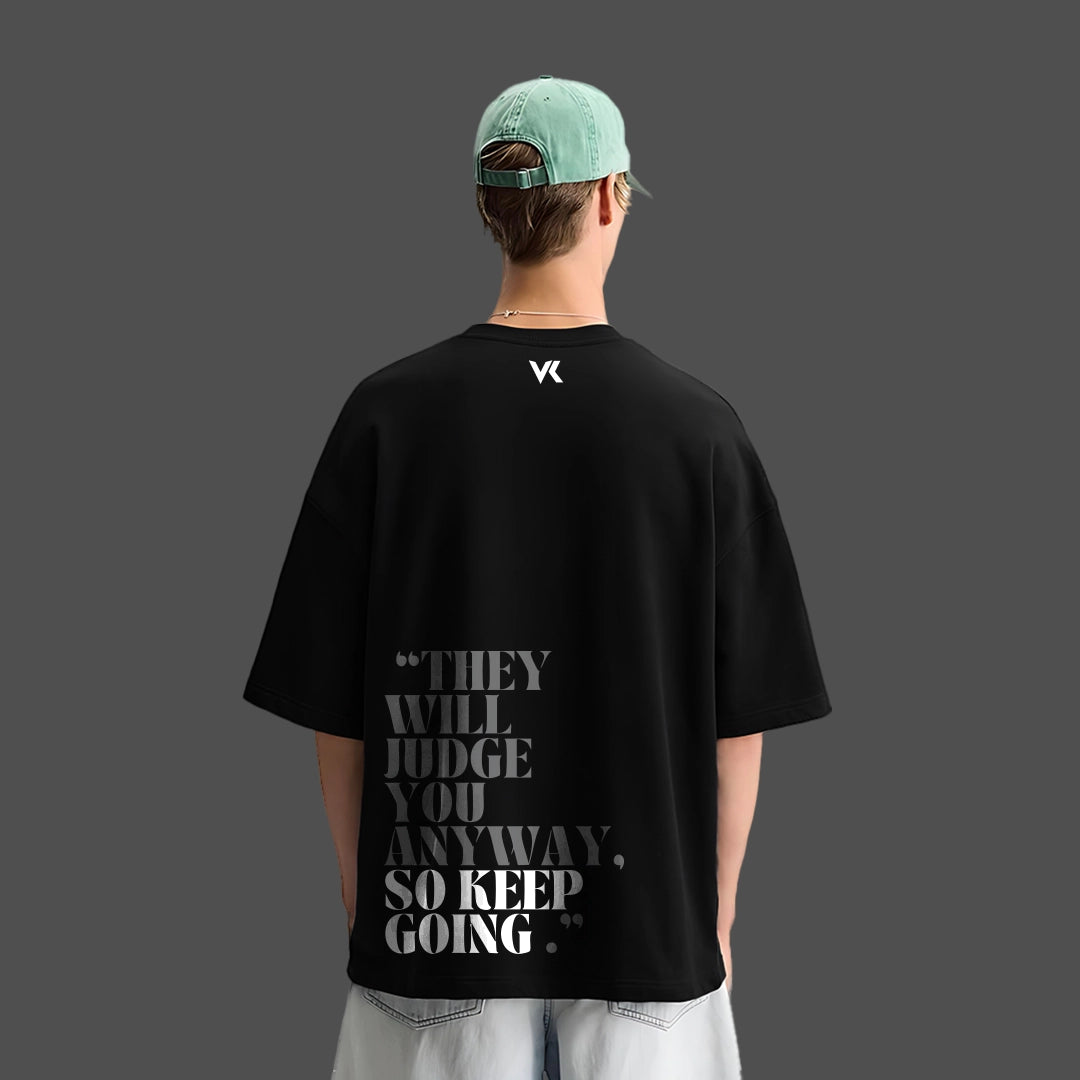 Black oversized streetwear t-shirt by Vlack featuring motivational text on the back