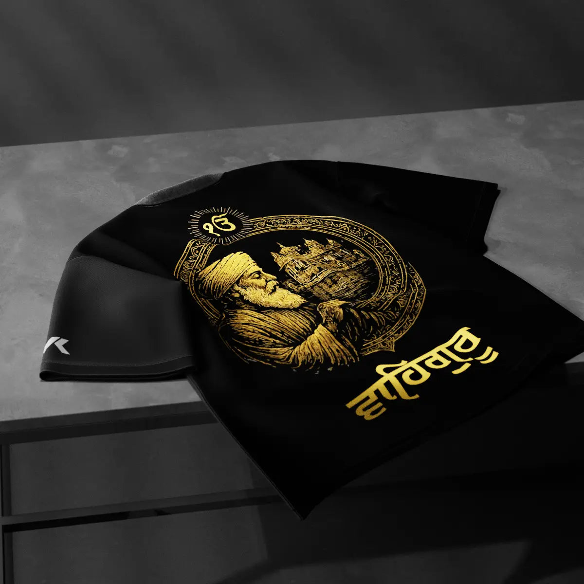 Vlack Guru Nanak Dev Ji black t-shirt featuring intricate gold artwork on a stylish design