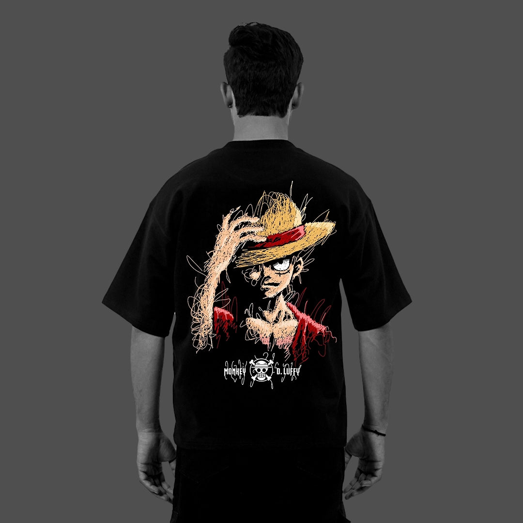 Back view of model wearing Vlack Black oversize black anime graphic t-shirt featuring straw hat anime character sketch