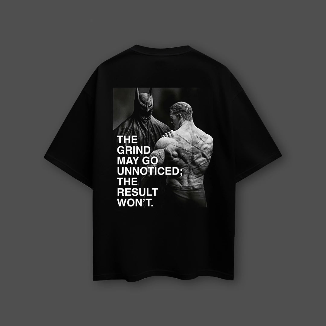 Oversized black streetwear t-shirt featuring bold graphic print and motivational quote on the back