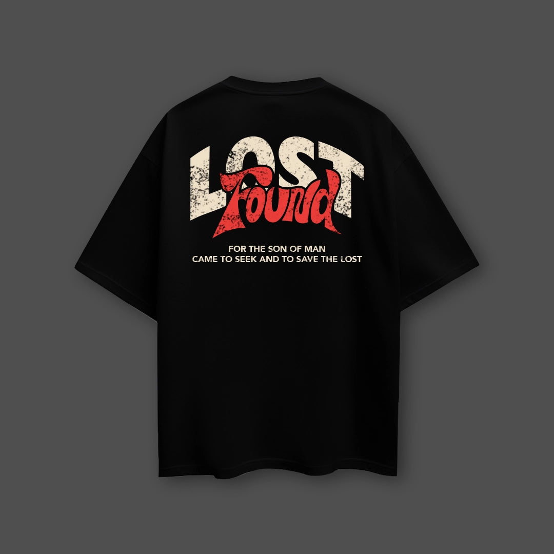 Oversized black t-shirt streetwear featuring a bold graphic design on the back