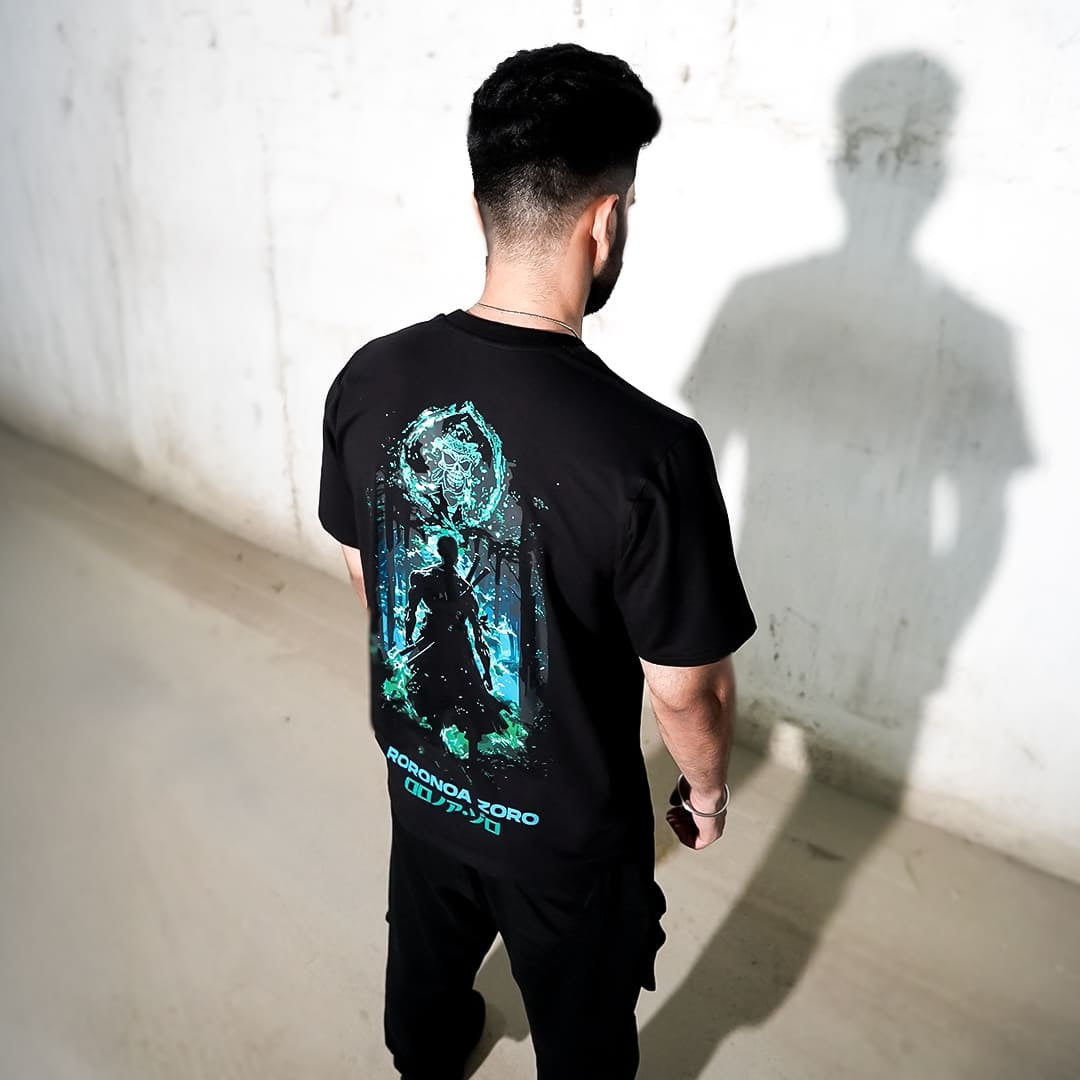 Black Oversize Tshirt with Roronoa Zoro anime print worn by male model in Roronoa Zoro streetwear India style