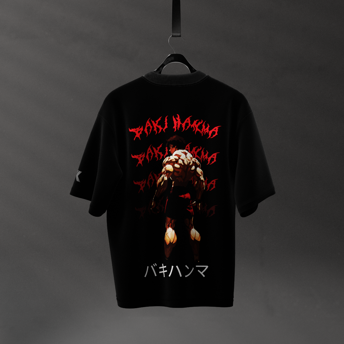Baki Hanma black oversized t-shirt featuring large muscular anime character graphic and red stylized text on back