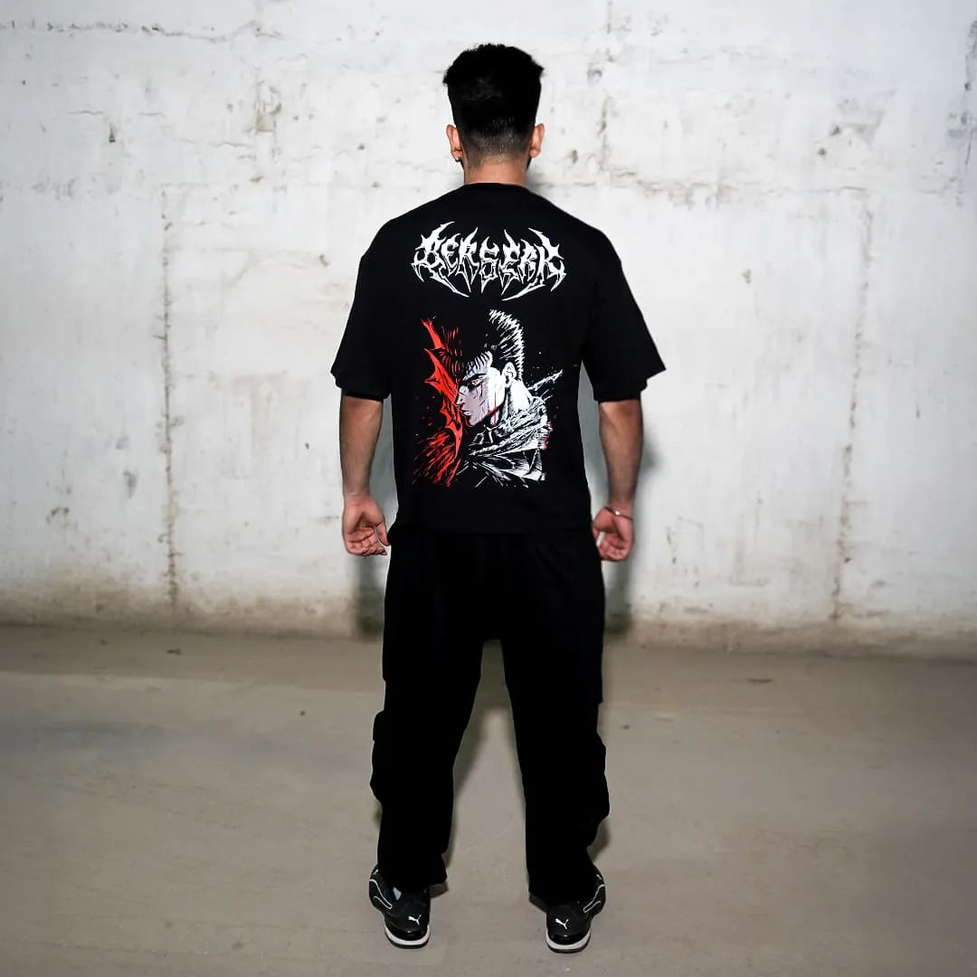 Male model wearing Berserk graphic black oversized t-shirt with red and white manga back print and relaxed fit