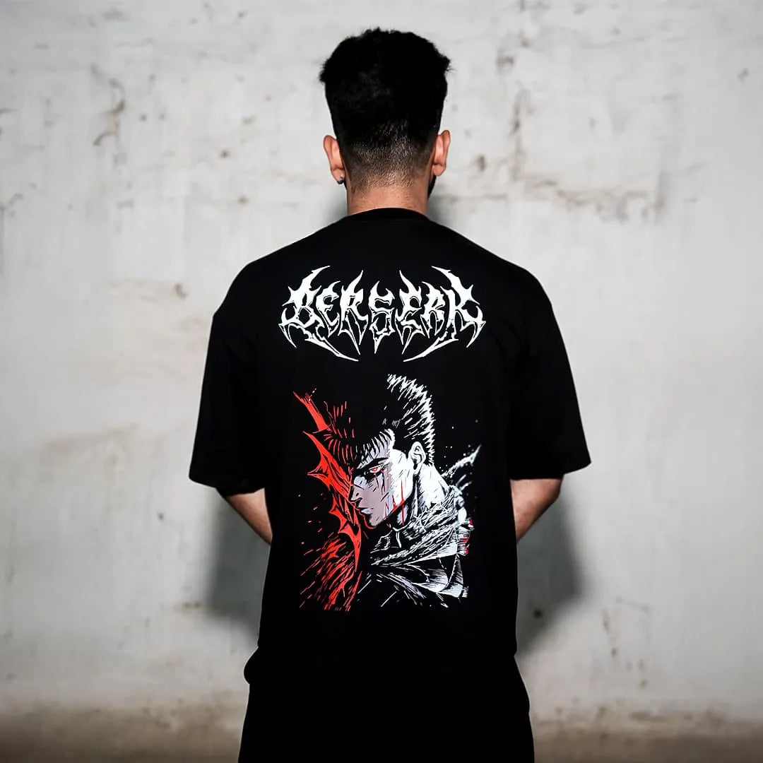 Rear view of Vlack model wearing Berserk graphic black oversized t-shirt with red and white manga back print
