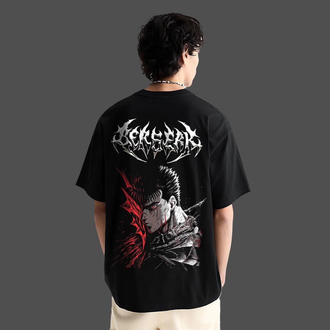 Model wearing Berserk graphic black oversized t-shirt by Vlack showing large back print of Guts with red blood splatter accents