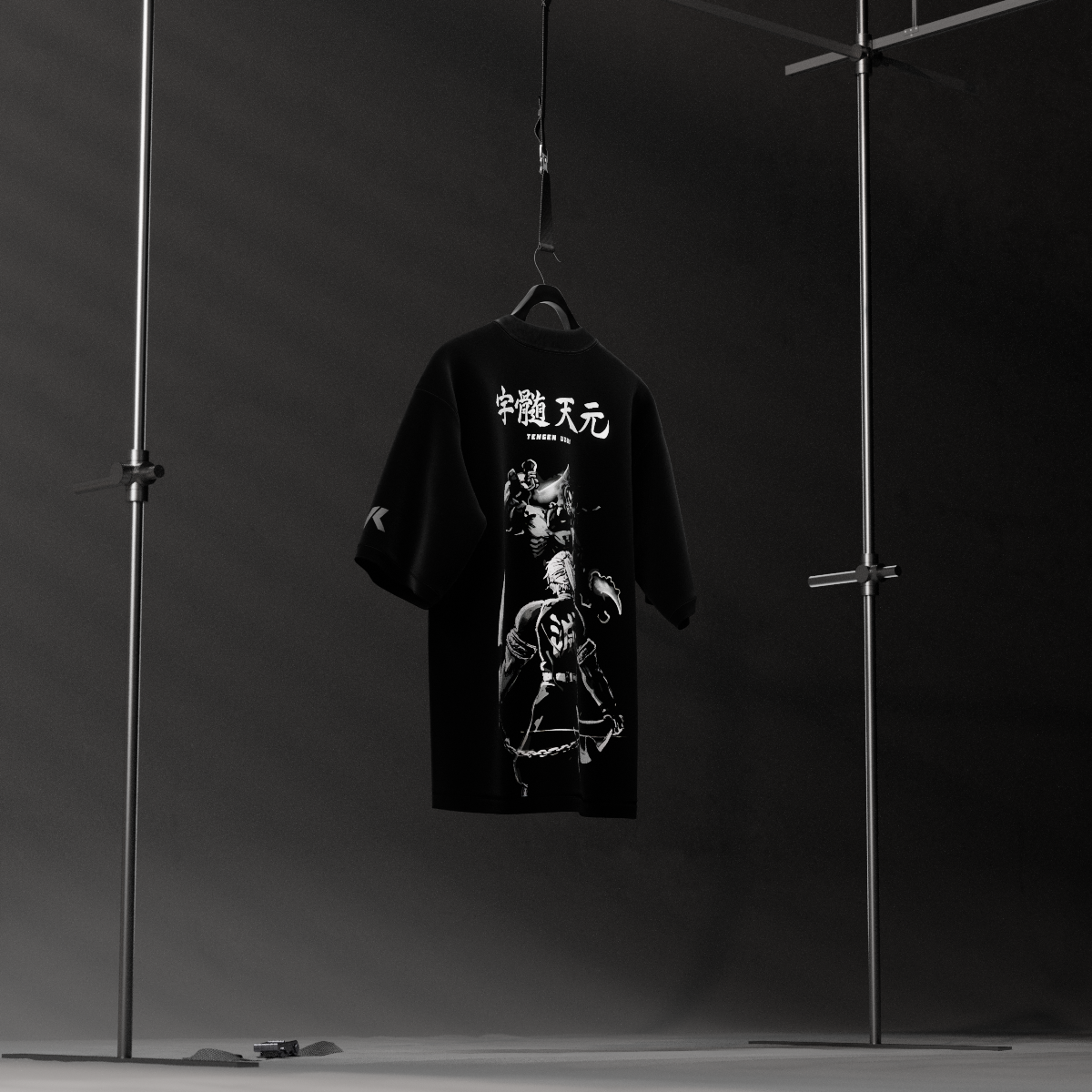 Tengen Uzui black oversized t-shirt from Vlack hanging on studio rack showing white back graphic and Japanese text