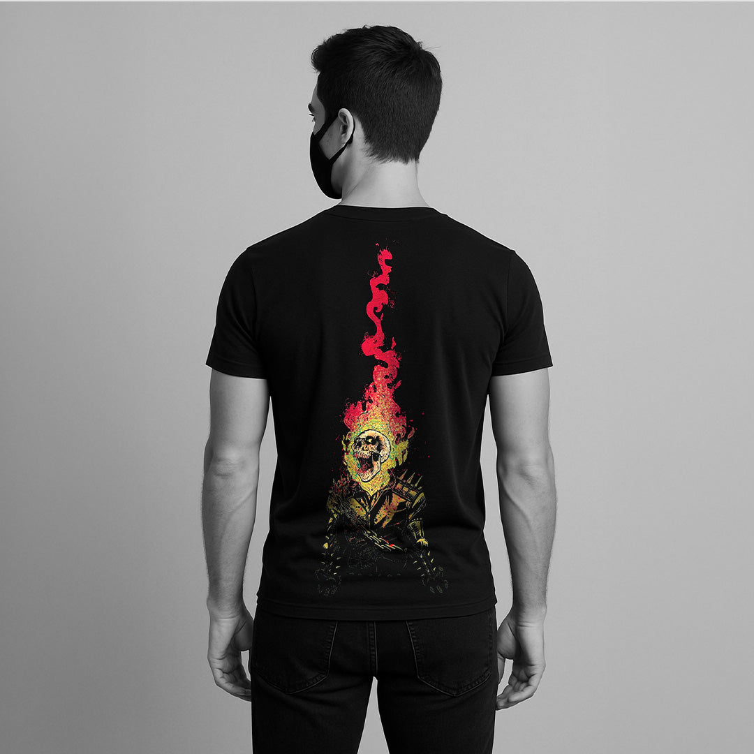 Back view of model wearing Vlack black graphic streetwear t-shirt with tall flaming skull print regular fit