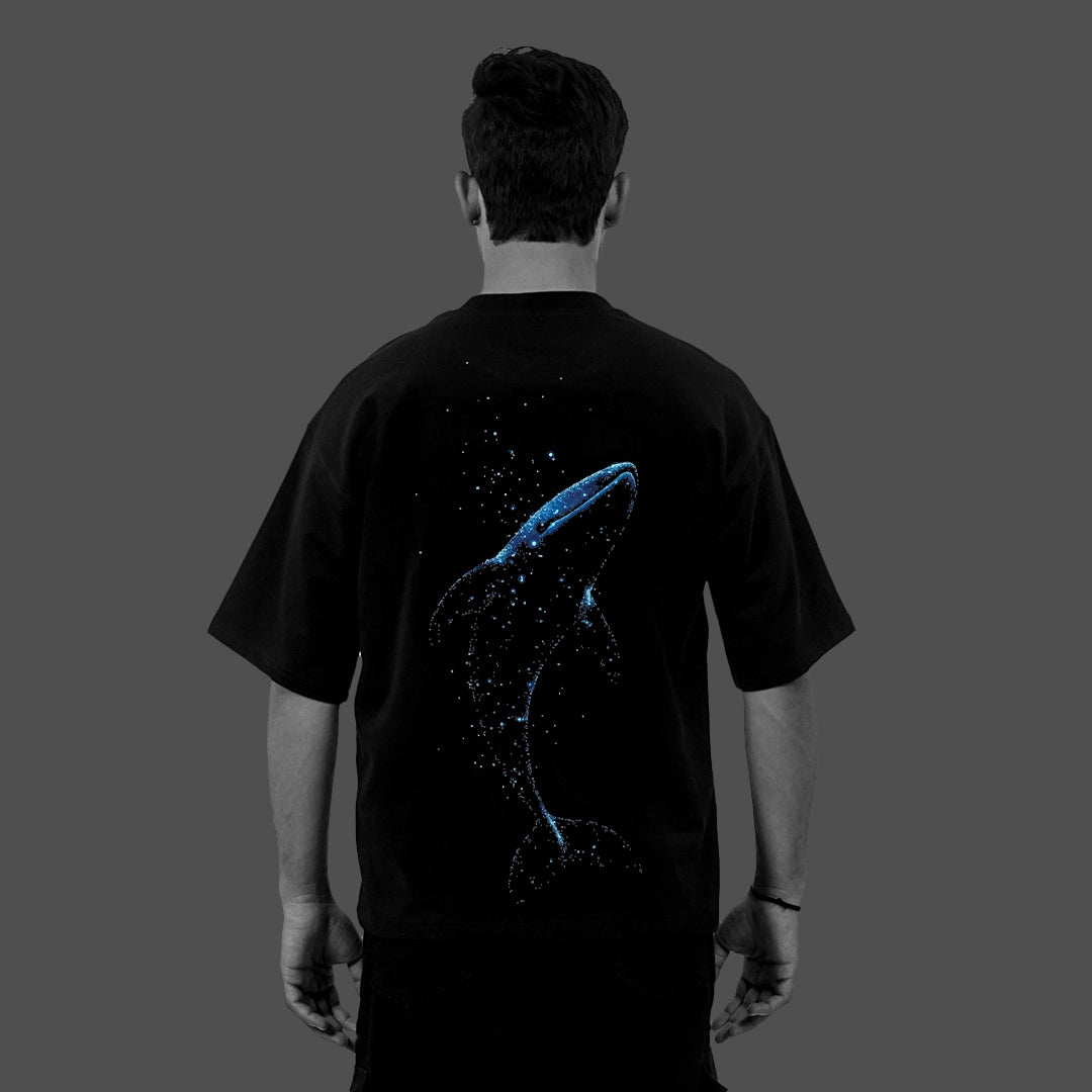 Vlack black oversize streetwear t-shirt back view with blue whale constellation graphic on relaxed fit