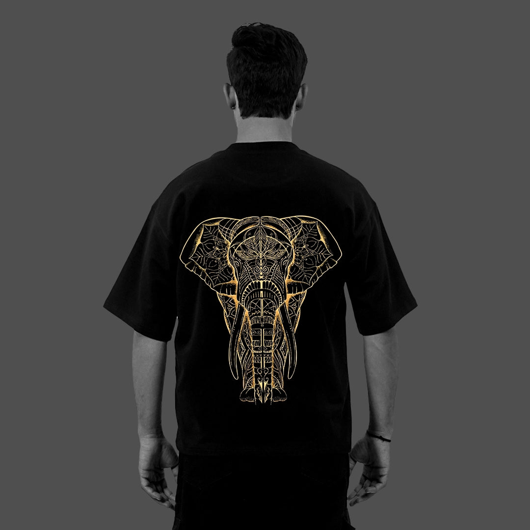 Vlack black oversized streetwear t-shirt with gold geometric elephant back print on male model