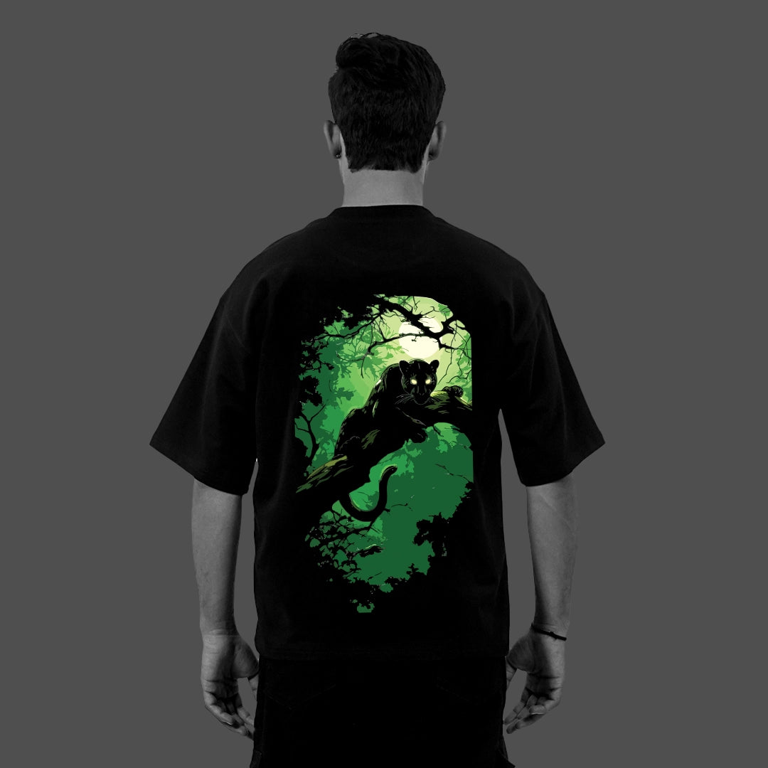 Vlack Black oversized tee with green jungle panther graphic on the back worn by model black panther oversize t-shirt
