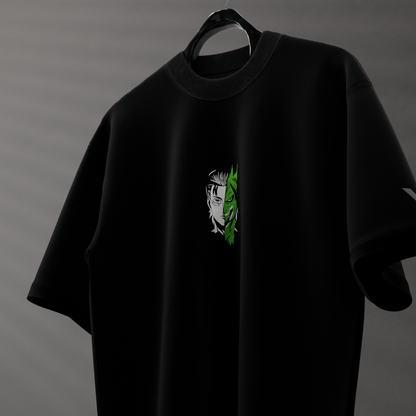 Armored Titan oversized black t-shirt featuring a unique graphic design on the front