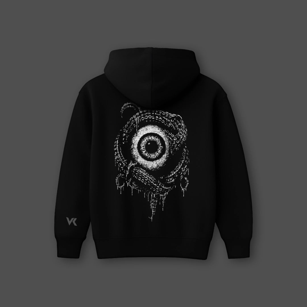 Black oversized streetwear hoodie featuring an intricate graphic design on the back
