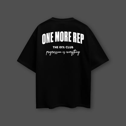 Black oversized streetwear t-shirt featuring a motivational back design with bold lettering