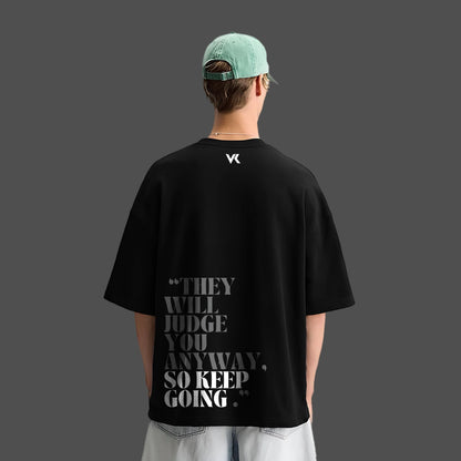 Black oversized streetwear t-shirt by Vlack featuring motivational text on the back