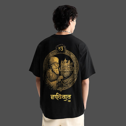 Oversize Vlack black t-shirt featuring Guru Nanak Dev Ji design and elegant gold detailing