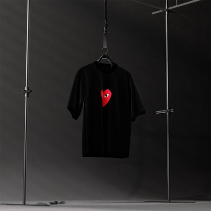 Oversized black heart eyes t-shirt featuring a striking red heart design for a trendy look
