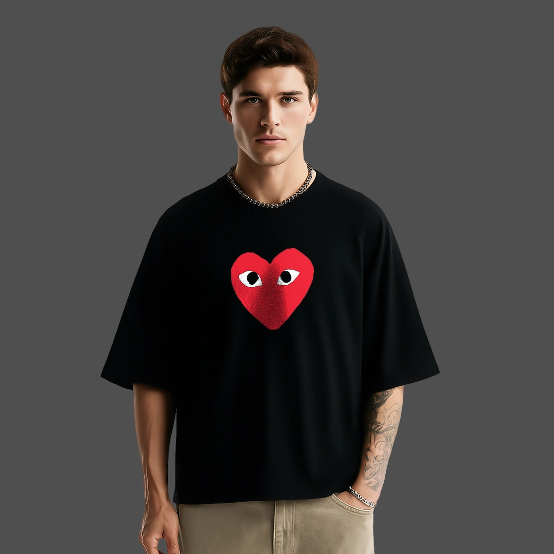 Oversized black heart eyes t-shirt featuring a bold heart graphic on the front