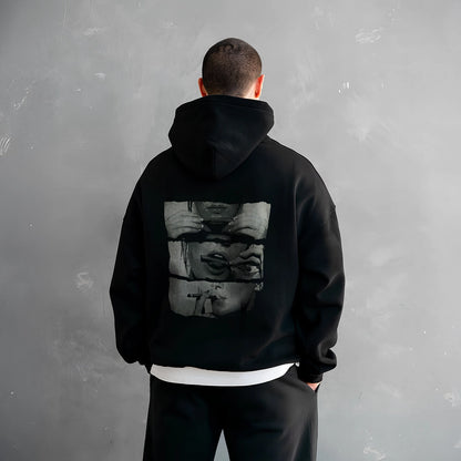 Men's oversized black hoodie for men featuring a unique graphic design on the back