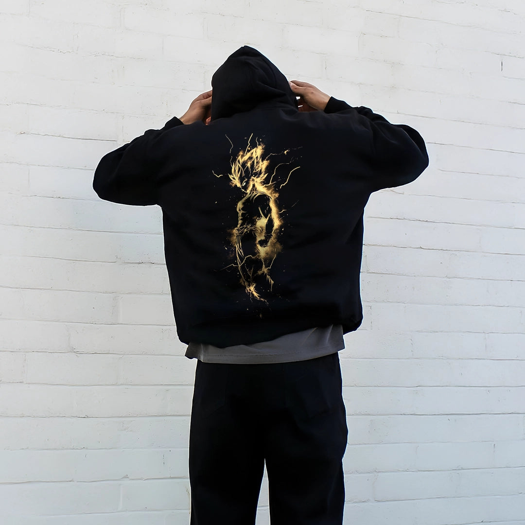 Stylish oversized black hoodie featuring a striking golden graphic on the back for a modern look