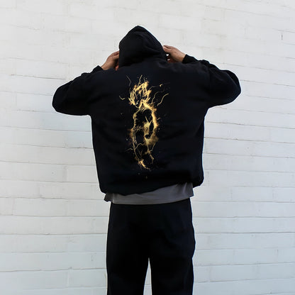 Stylish oversized black hoodie featuring a striking golden graphic on the back for a modern look