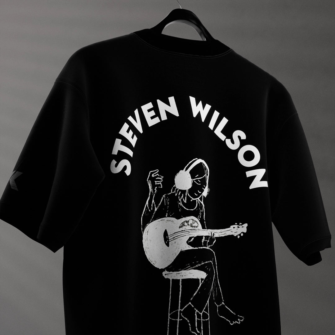 Steven Wilson oversized black t-shirt featuring an artistic graphic of a musician with a guitar