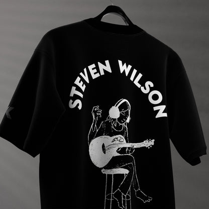 Steven Wilson oversized black t-shirt featuring an artistic graphic of a musician with a guitar