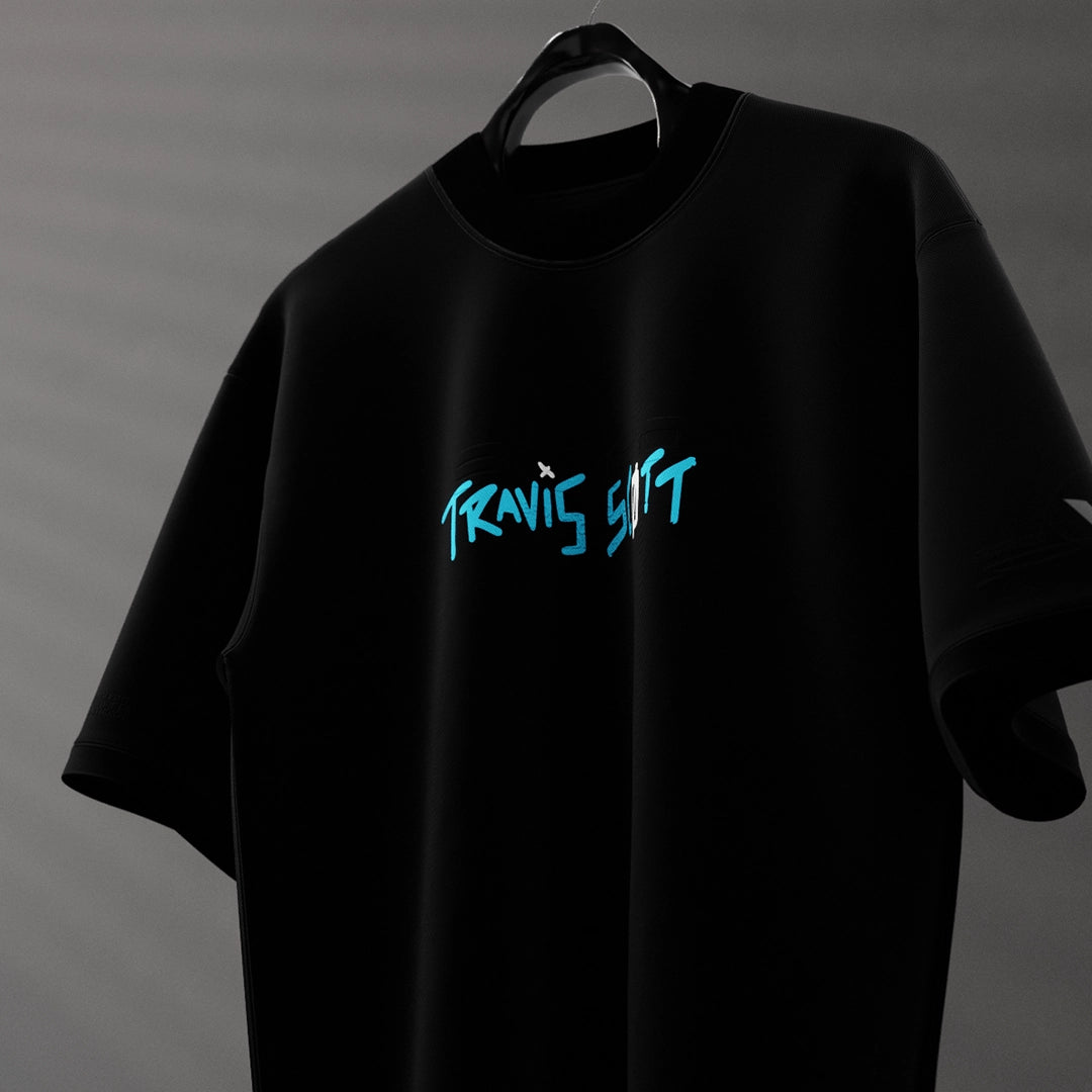 Travis Scott Astro World oversized black t-shirt featuring bold logo design in blue