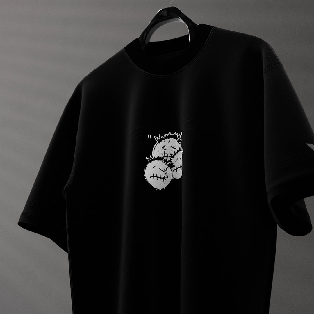 Travis Scott black oversized t-shirt featuring unique graphic design on the front