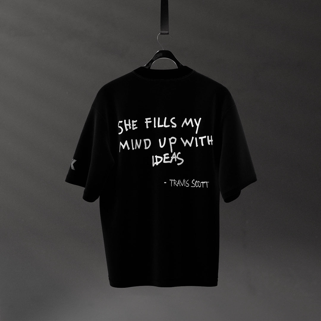 Travis Scott black oversized t-shirt featuring the quote She fills my mind up with ideas on the back