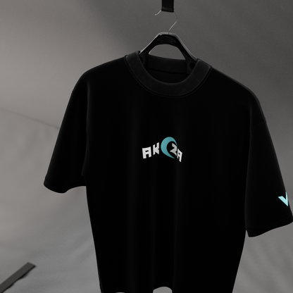 Oversize Akaza Demon Slayer black t-shirt by Vlack hanging on a hanger with small teal logo on chest