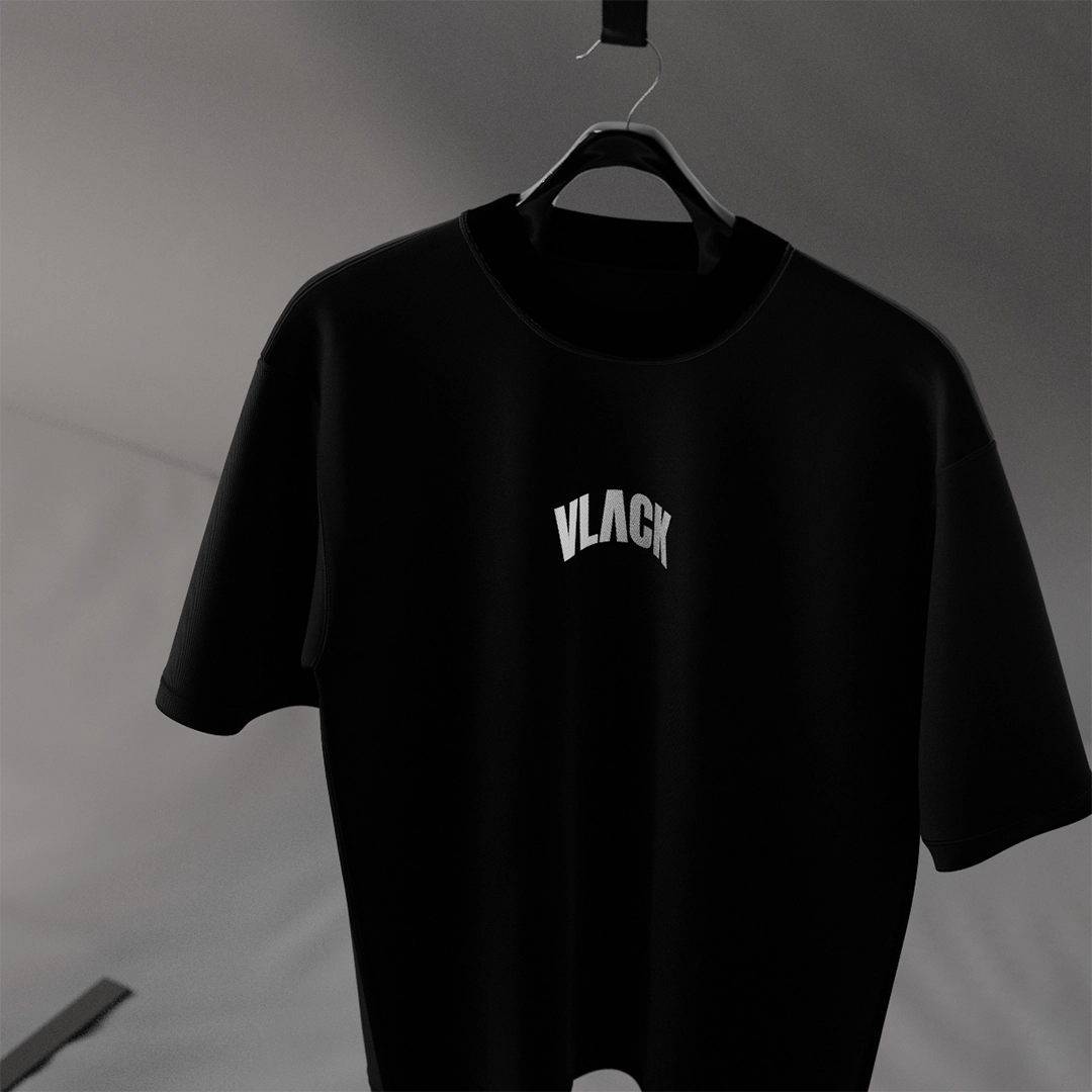 Vlack black oversize fit streetwear t-shirt displayed on a hanger with simple branding