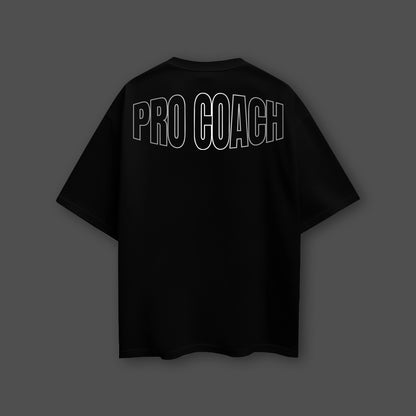 Black oversized streetwear t-shirt featuring a bold PRO COACH graphic on the back