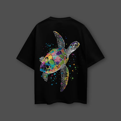 Vlack black oversized streetwear t-shirt with vibrant multicolor mosaic sea turtle graphic and paint splatter on back