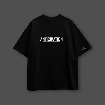 Vlack black oversized streetwear t-shirt featuring 'ANTICIPATION' graphic for comfortable casual wear