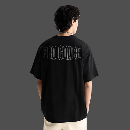 Black oversized streetwear t-shirt featuring 'PRO COACH' text on the back for a trendy look