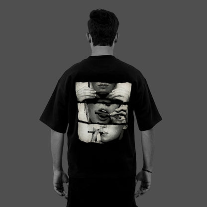 Vlack black oversized streetwear t-shirt shown on a model from back with monochrome triptych face graphic and relaxed fit