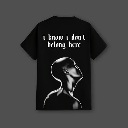 Vlack fit black streetwear t-shirt with large back print reading i know i do not belong here and glossy white sculpted head