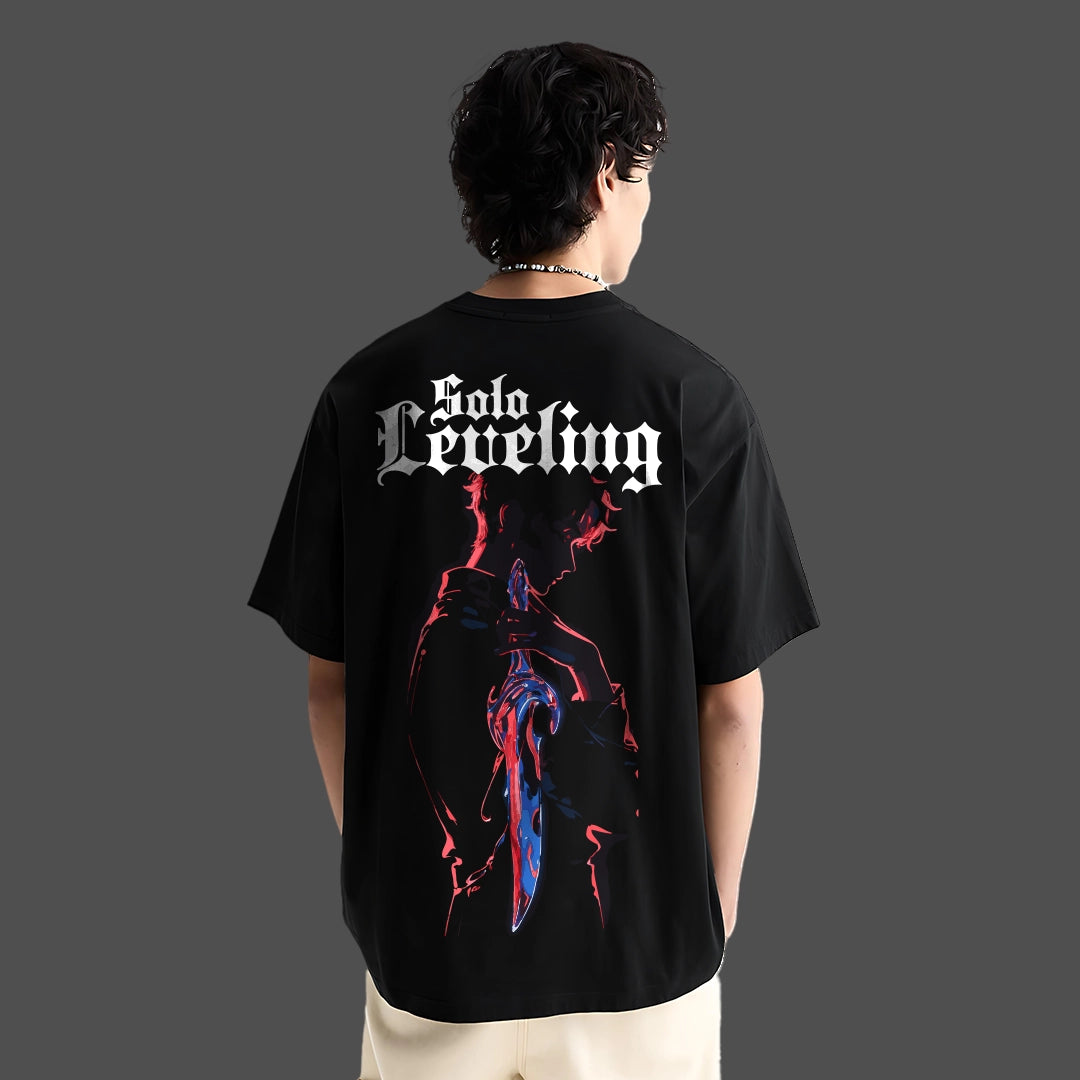 Model wearing Solo Leveling black oversized tshirt by Vlack showing back anime graphic of shadowed hunter with dagger
